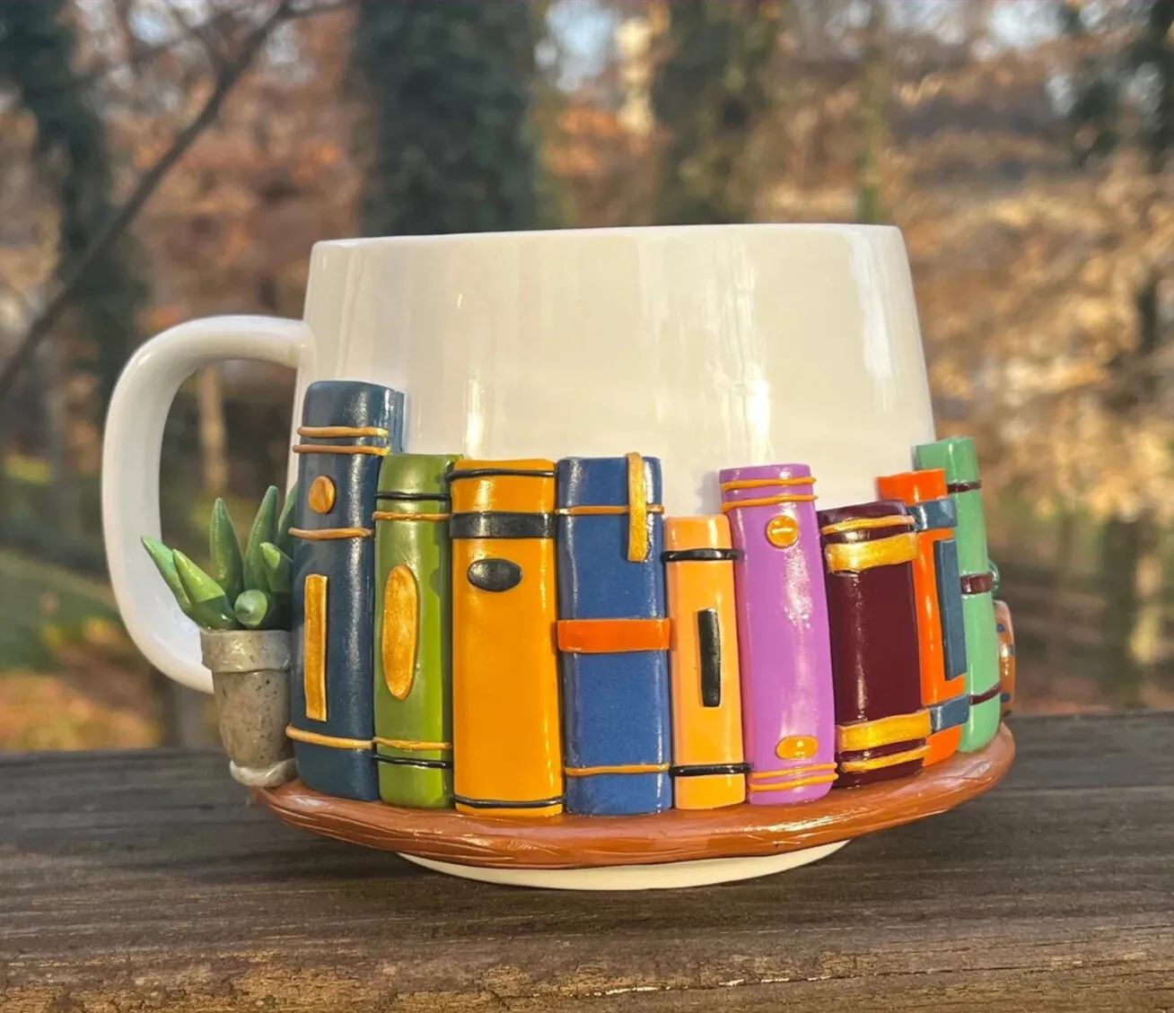 Bookshelf mug on a table in the woods.
