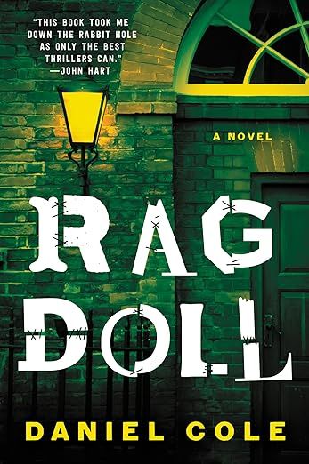 cover of Ragdoll by Daniel Cole; green-tinted photo of a light on in front of a house door