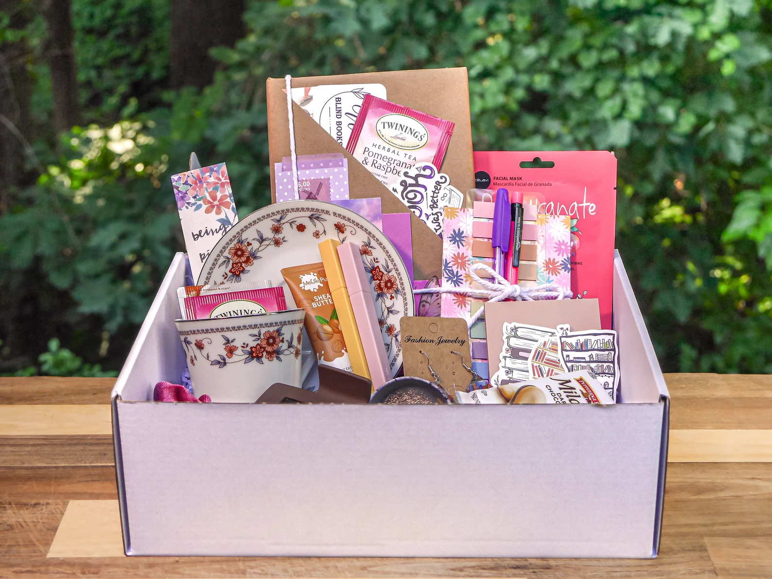 blind date with a book box set with a teacup and other bookish goodies