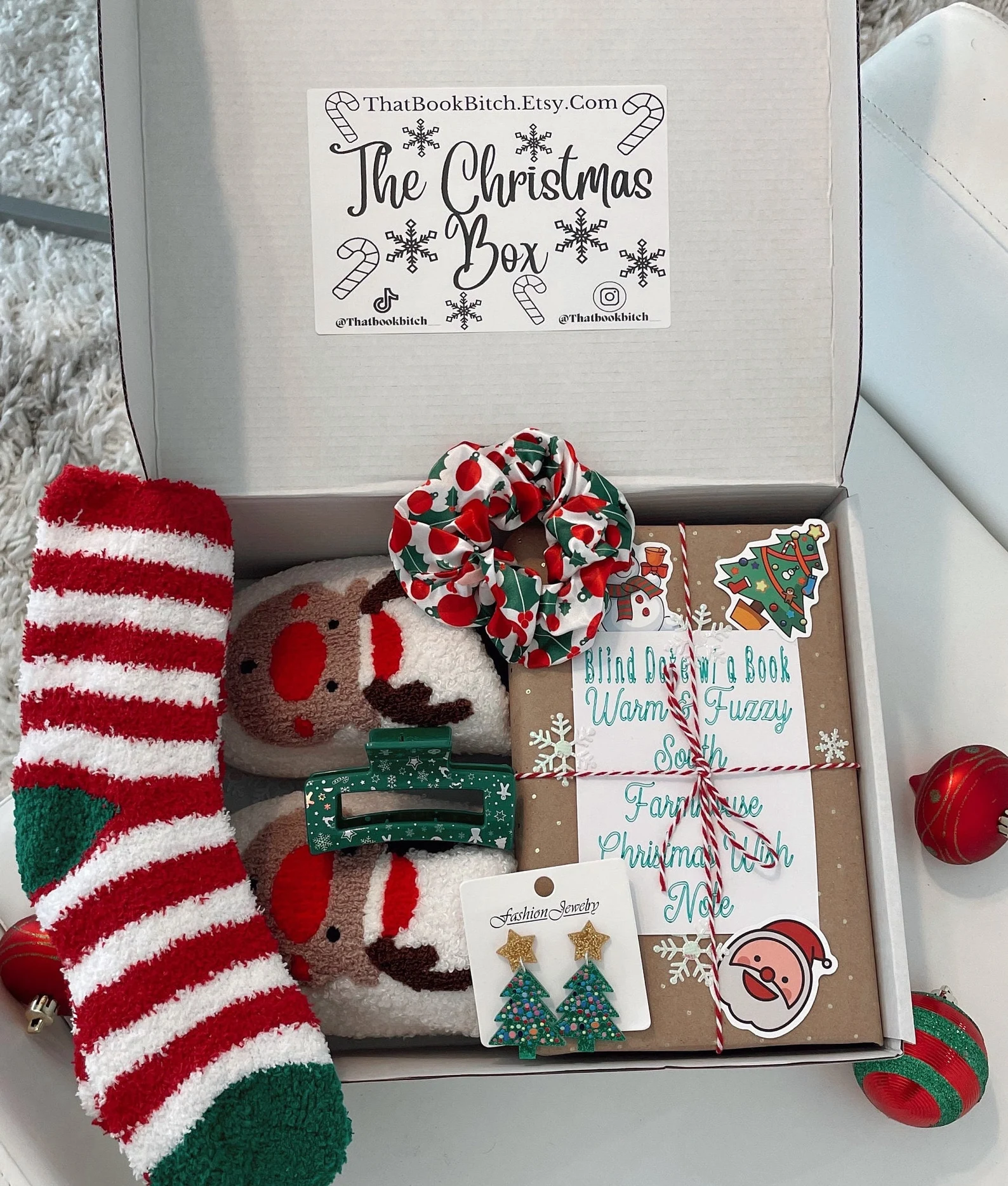 christmas blind date book box with socks and earrings