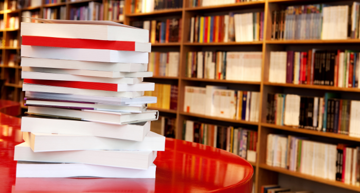 a photo of a stack of books on a table at a bookstore