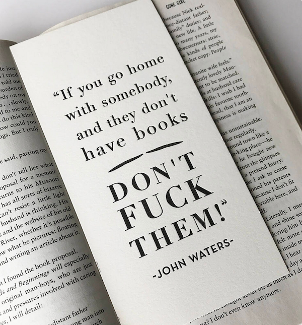 a book mark wiht a famous John Waters quote about not sleeping with anyone that doesn't own books