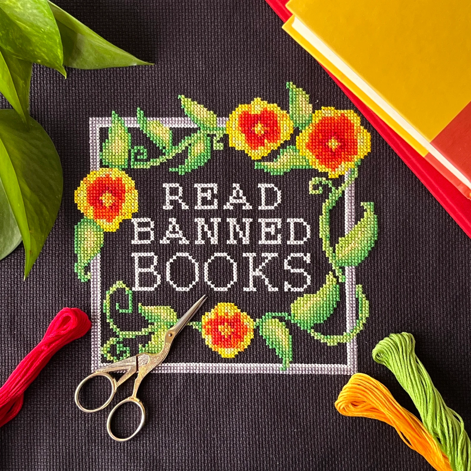 Image of a downloadable cross stitch pattern that says "read banned books."