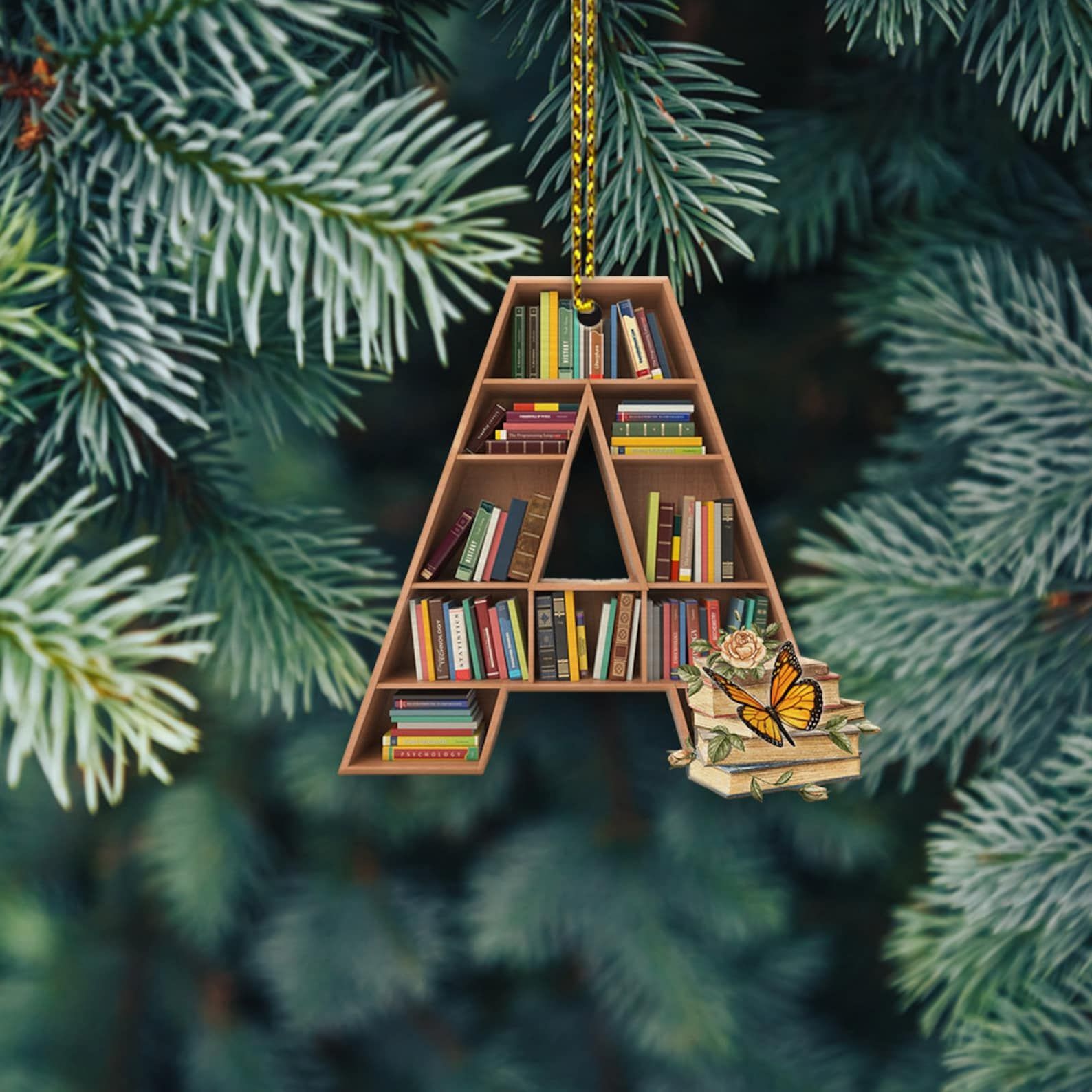 An ornament in the shape of an A with bookshelves and mini books
