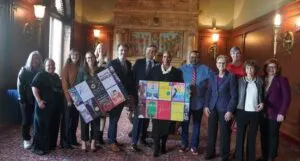 Press release image of attendees at "Books Save Lives" Library of Congress roundtable