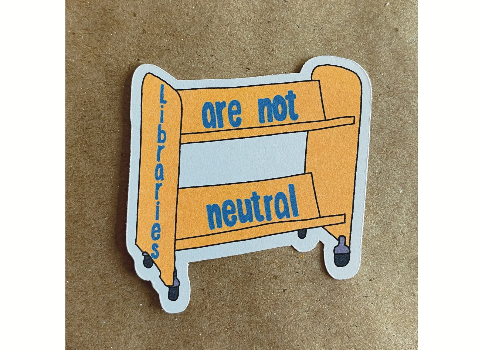 book cart sticker with blue text that reads "libraries are not neutral."