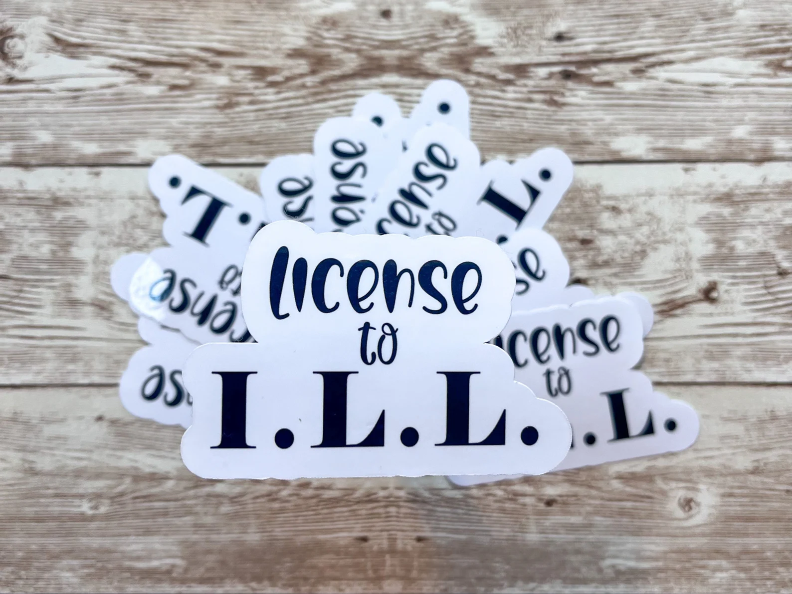 Image of a sticker that reads "license to I.L.L."