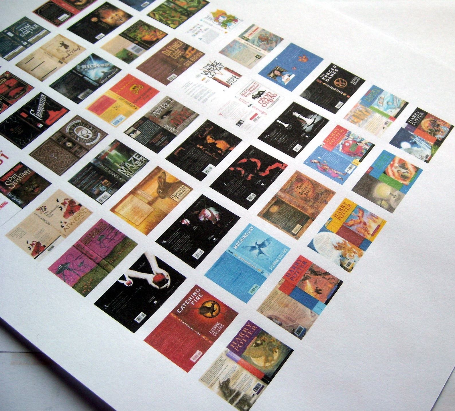 A sheet of paper with rows of book covers printed on it. 