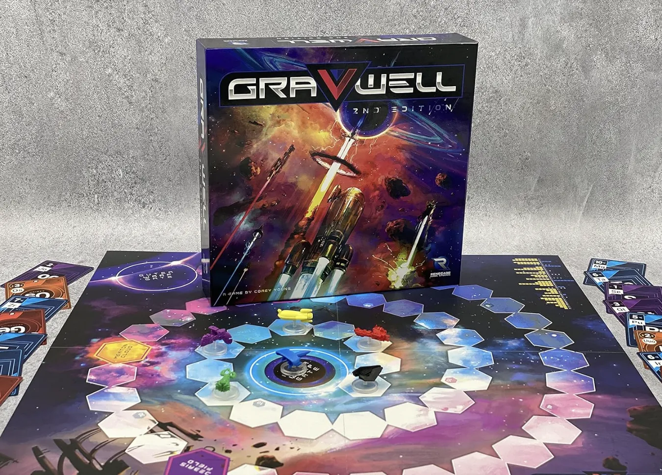 Gravwell second edition game box on top of board