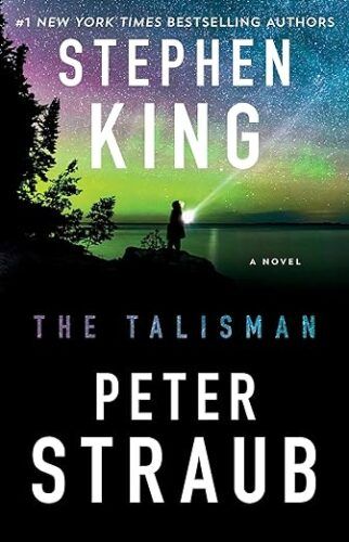 cover of The Talisman by Stephen King and Peter Straub; image of a person standing in the dark with a flashlight beneath the northern lights