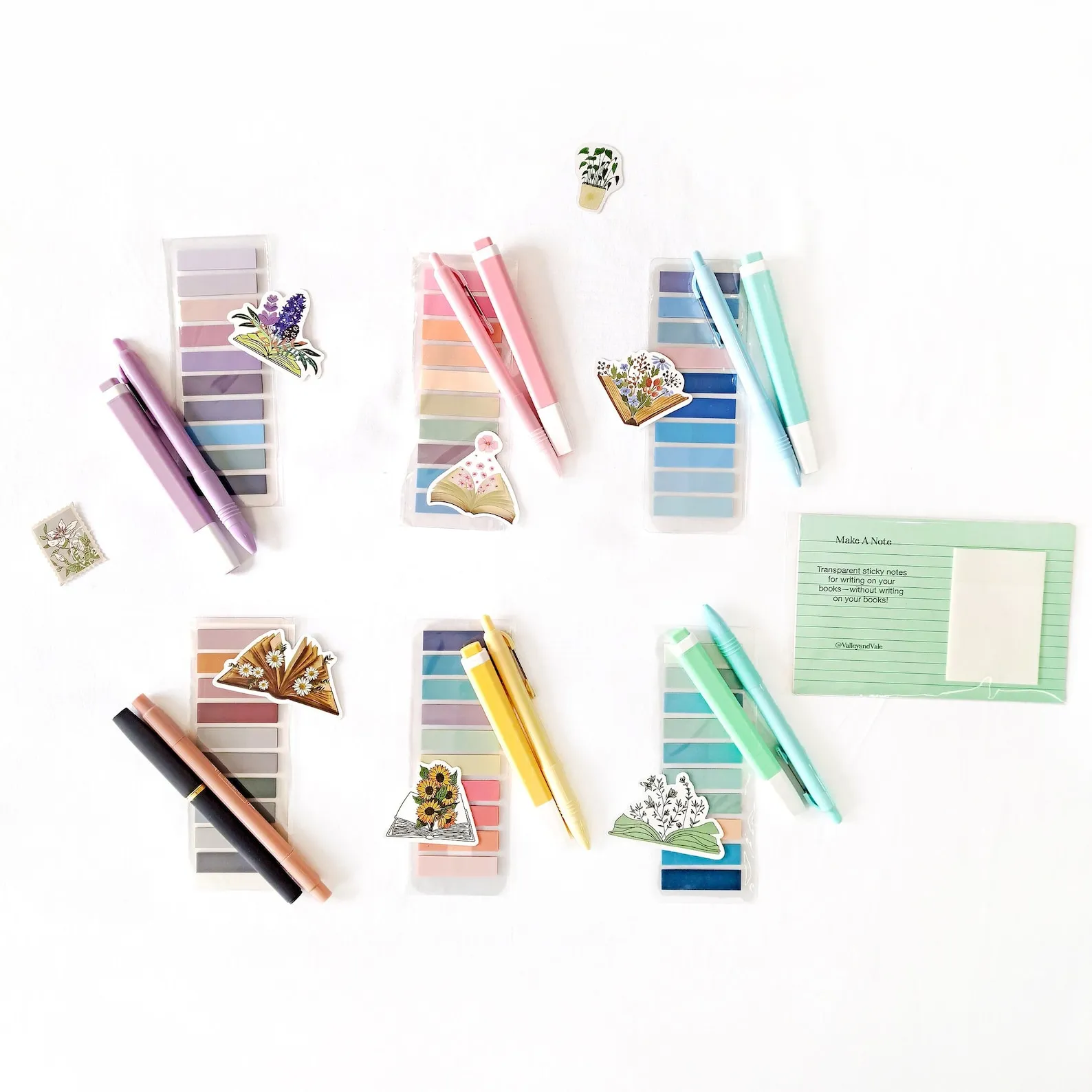 Various sets of tab kits with coordinating pens and highlighters, with bookish stickers