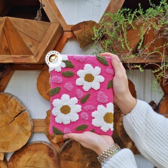 bright pink plush fabric sleeve with white daisies 