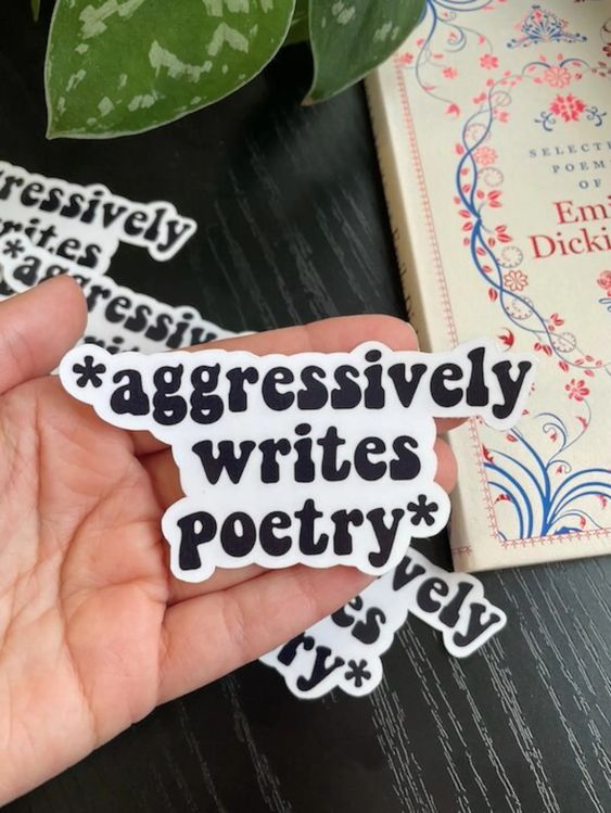 black and white sticker that reads "aggressively writes poetry"