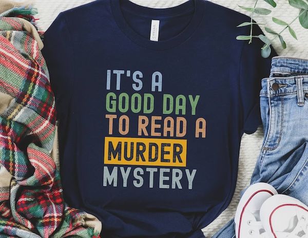 dark blue tshirt with text that reads "It's a good day to read a murder mystery"