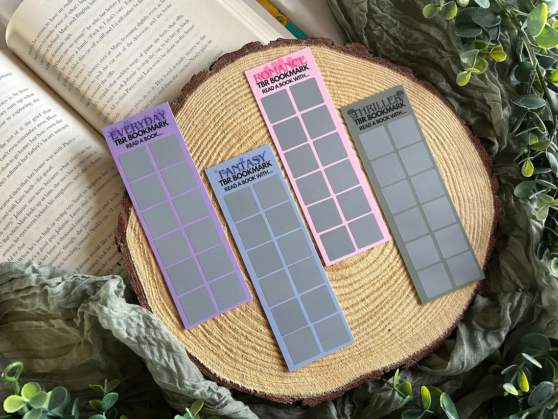 Four bookmarks with small squares of scratch off