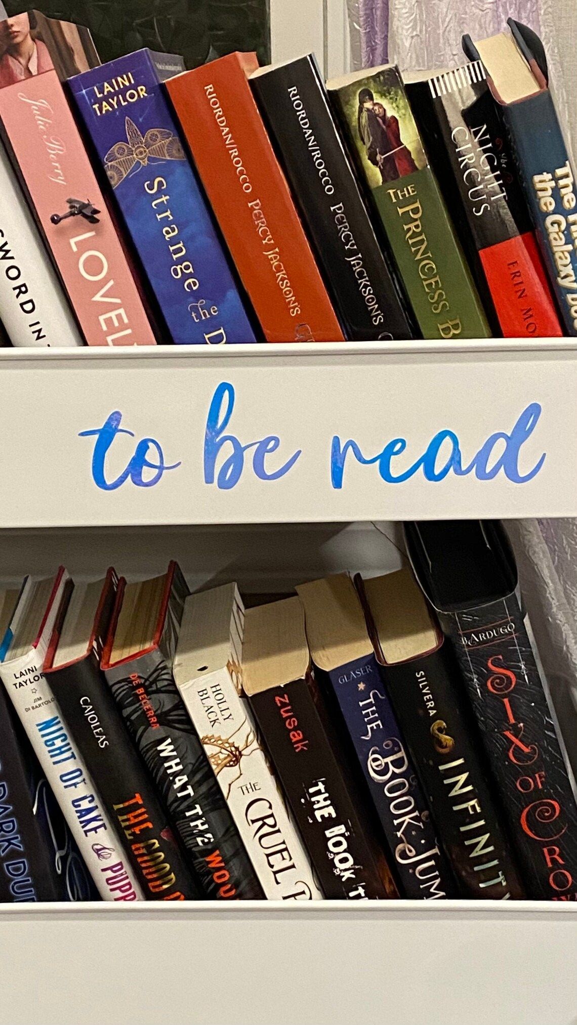 to be read vinyl sticker on rolling cart with books in it