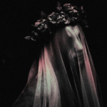 cropped cover of My Darling Dreadful Thing, showing a woman with a veil over her face