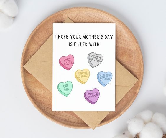white bifold card with candy hearts marked with romance tropes and the heading "I Hope Your Mother's Day If Filled With"