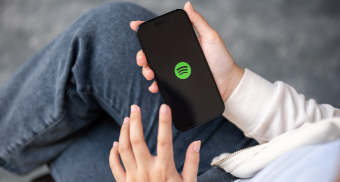 a person loading the Spotify app on their phone