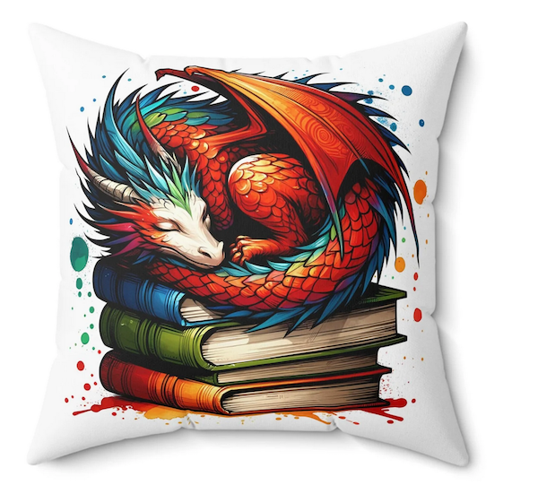 a square white pillow with graphic screen print of a colorful dragon sleepign on a pile of books