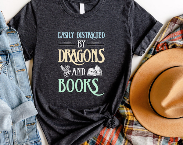 a tshirt that says Easily Distracted by Dragons and Books
