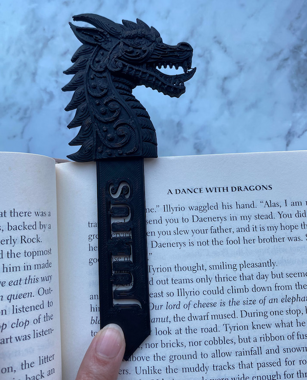 bookmark 3D printed of a dragon head with a tab that can have a personalized name