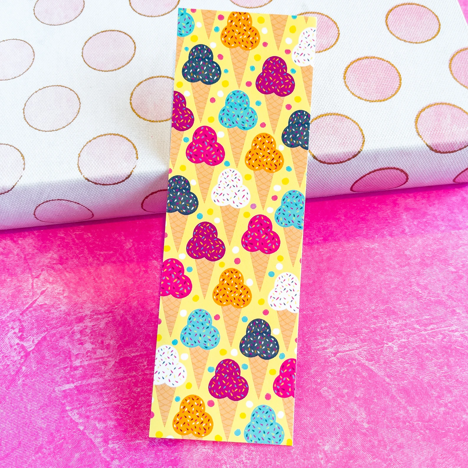 Image of a colorful bookmark with ice cream cones on it. 
