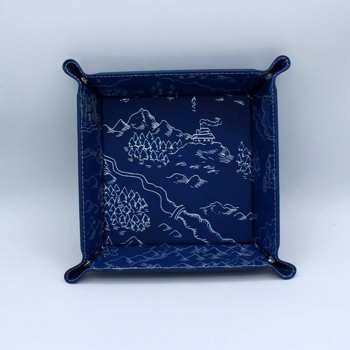 Blue dice tray with white map print