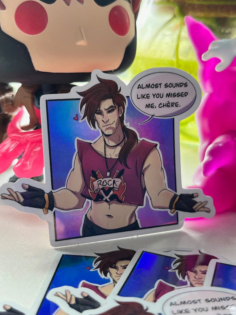Gambit sticker with speech bubble reading, "almost sounds like you missed me, chere."