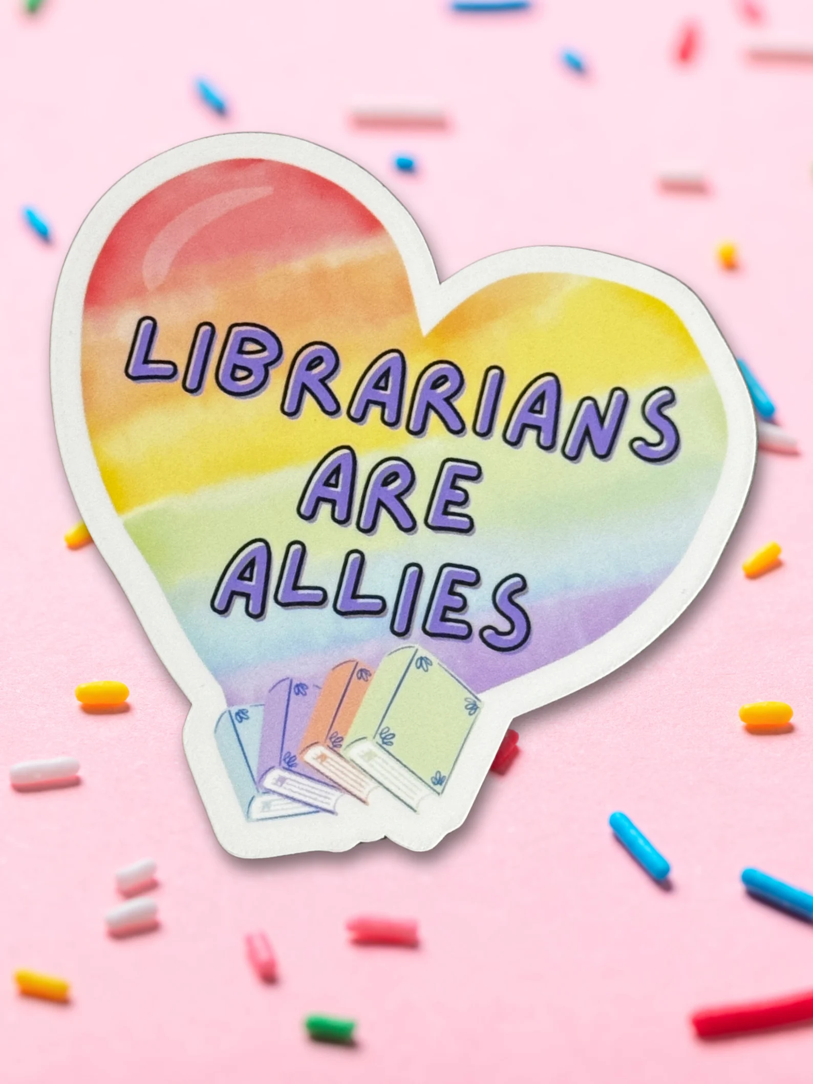 rainbow heart sticker that says librarians are allies.
