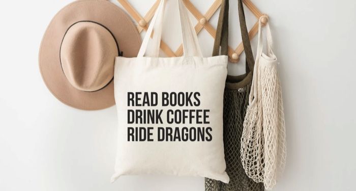 a tote bag with black text that says Read Books Drink Coffee Ride Dragons