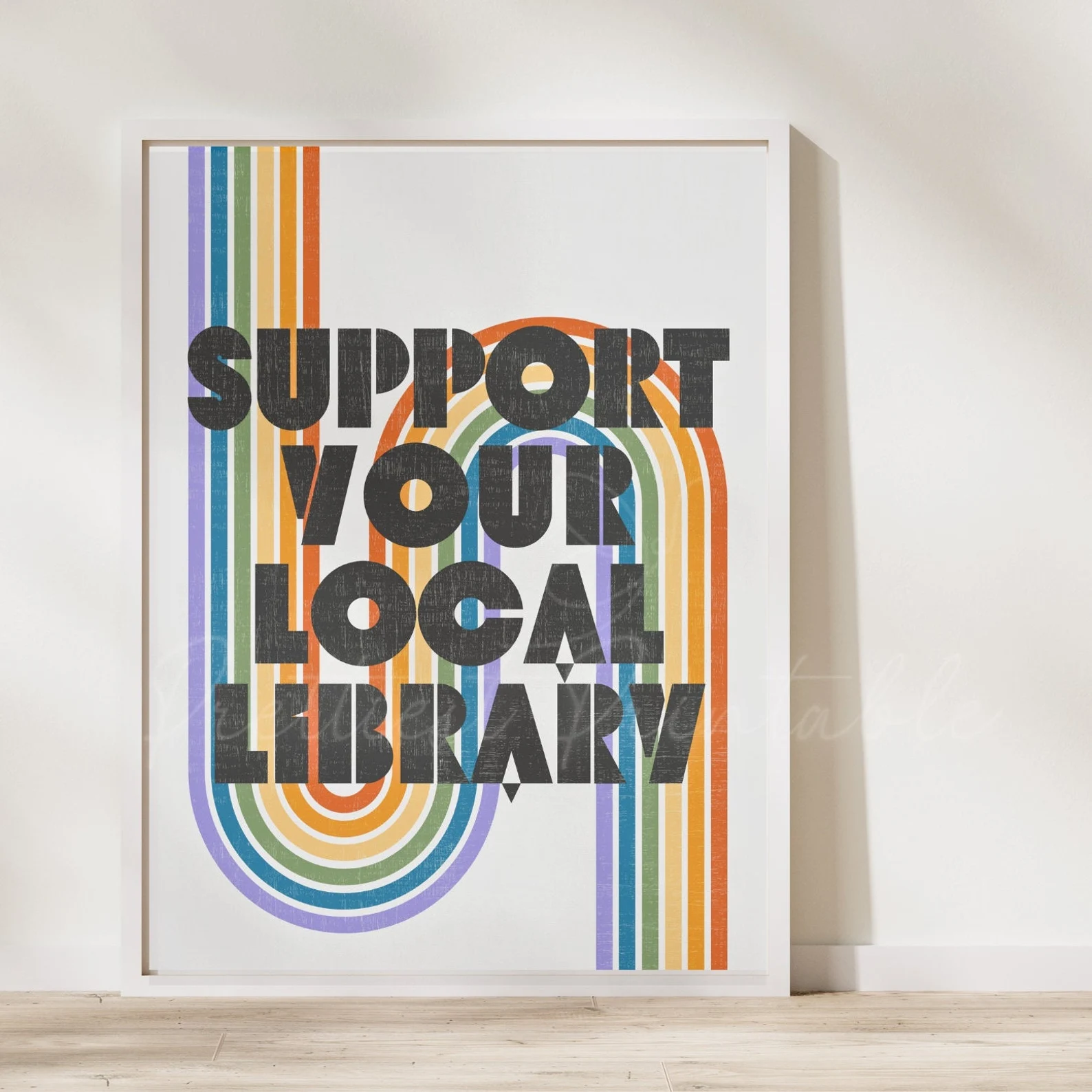 downloadable art that says "support your local library" with a rainbow behind it. 