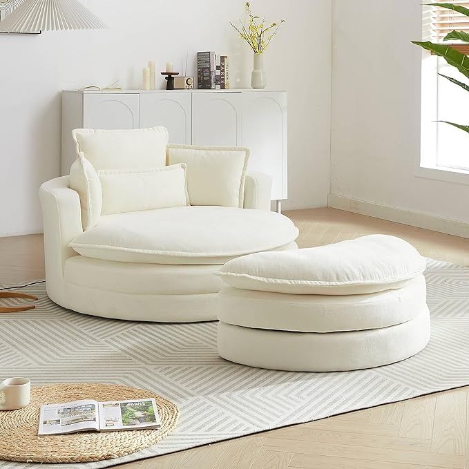 a white oversized barrel chair with ottoman