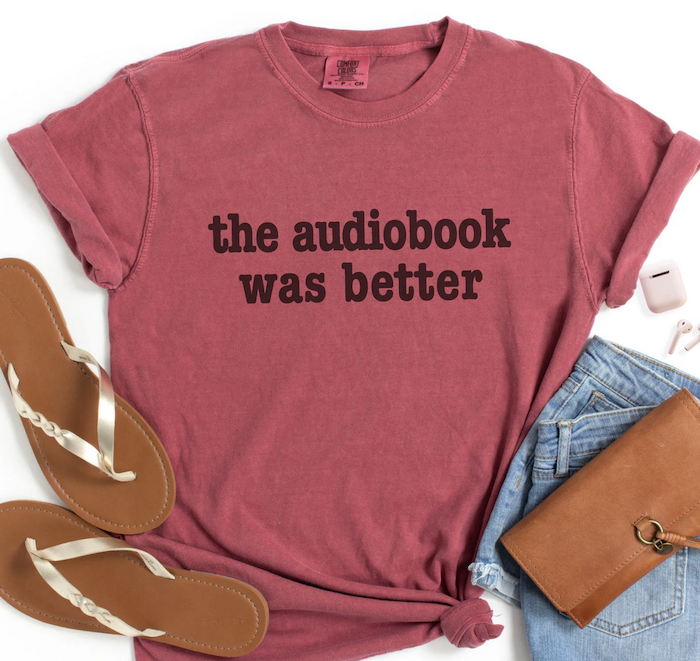 a crimson shirt with lettering that says "the audiobook was better"