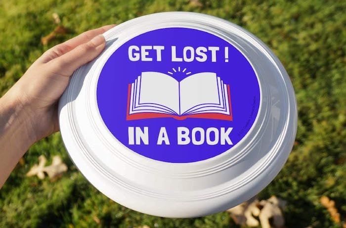 frisbee with "get lost in a book" printed on it