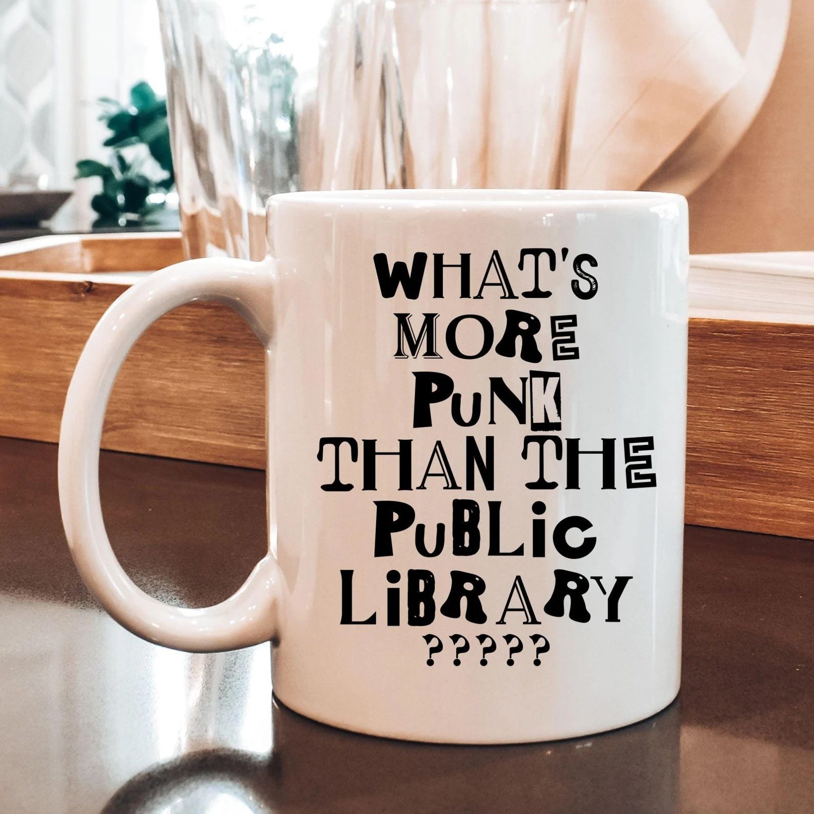 a mug that says, "What’s More Punk Than A Public Library"