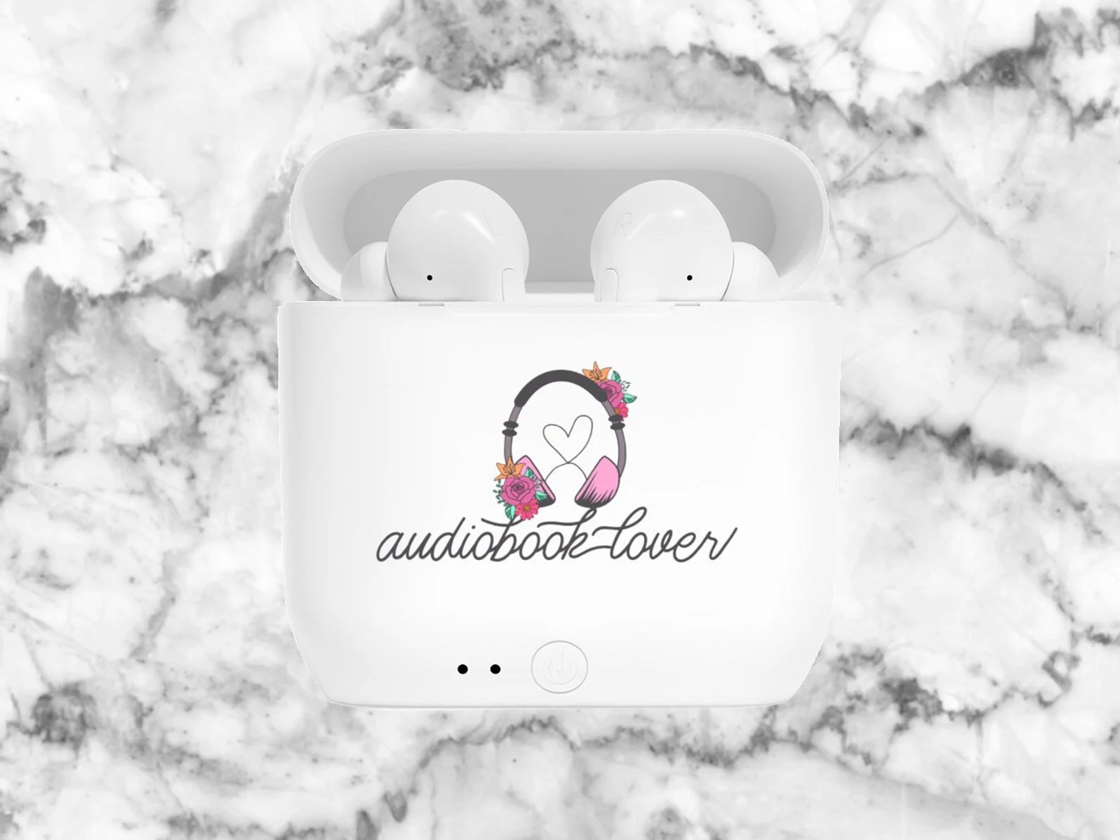 Image of white earbuds in a white case with "audiobook lover" on the case. 