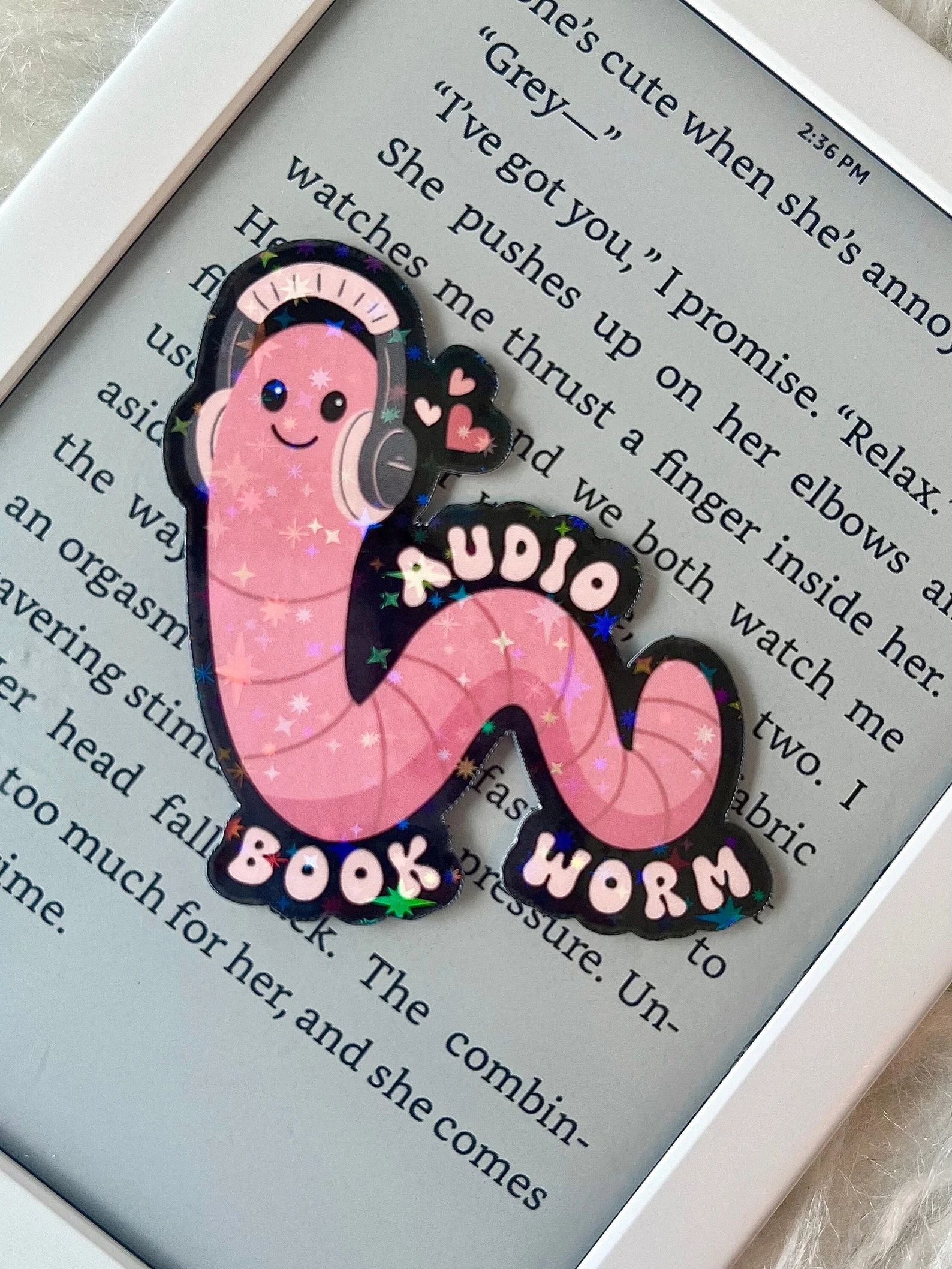 pink sparkly sticker that features a worm and says "audio book worm."