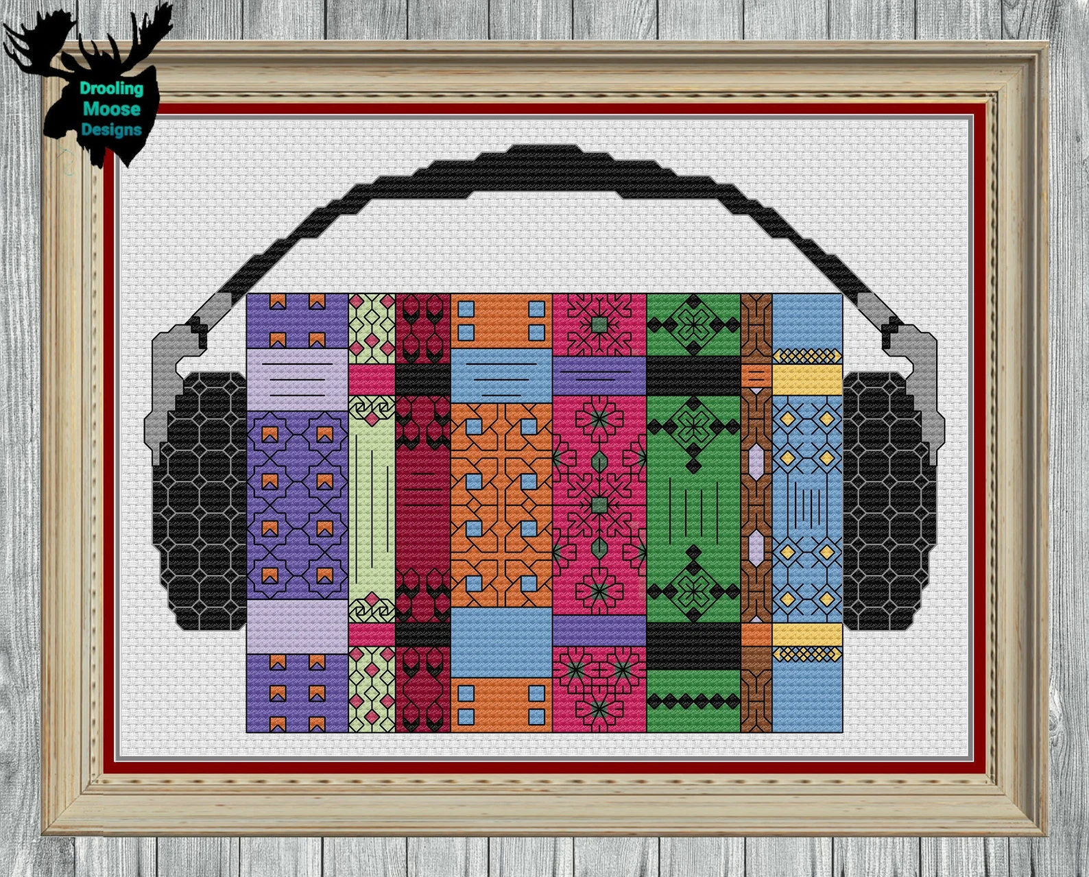 Image of a cross stitch pattern featuring books and headphones.