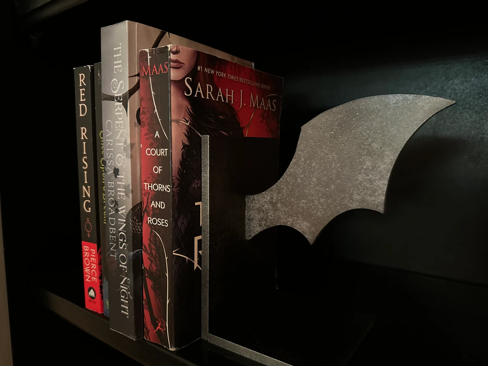 Image of a bat wing bookend.