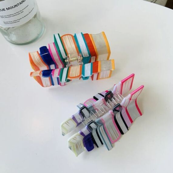 image of two hair claw clips that look like a stack of books