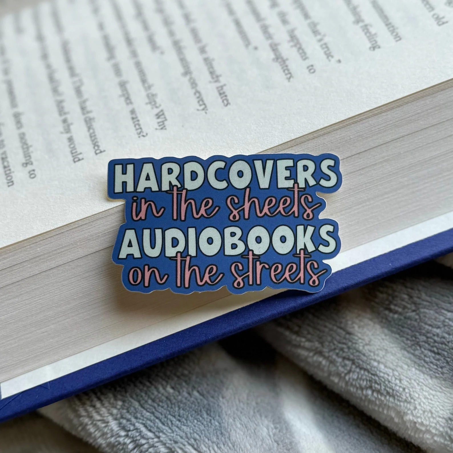 sticker that reads "hardcovers in the sheets, audiobooks on the streets."