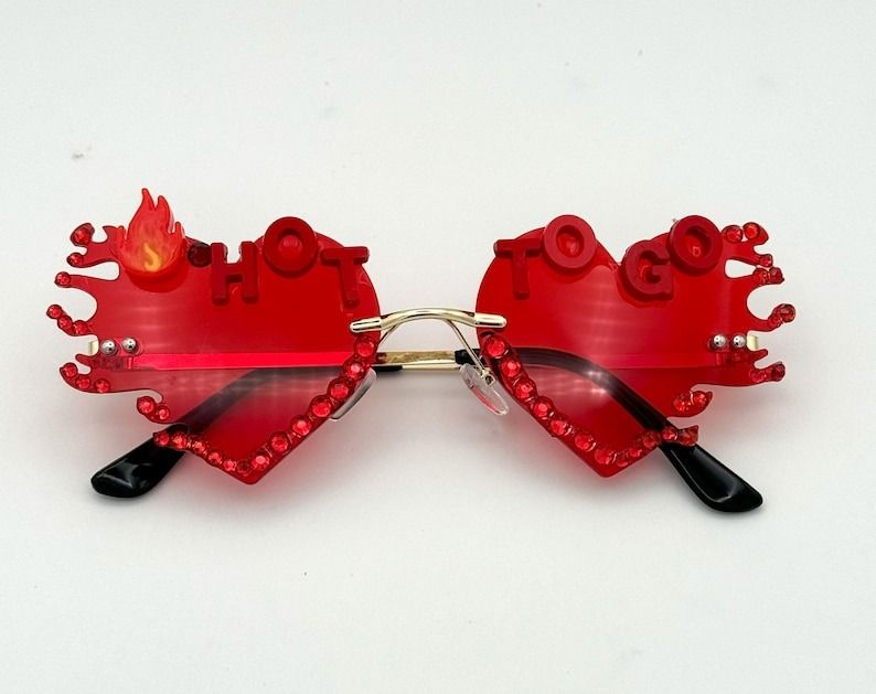 red heart-shaped sunglasses with the text "Hot To Go" across the top