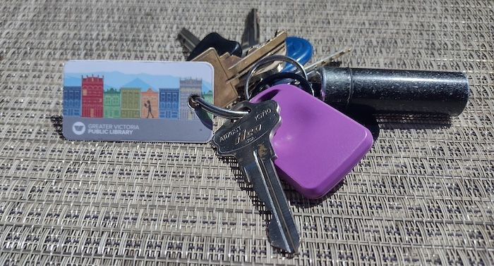 a photo of a library card on a keychain