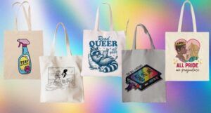 five LGBTQ-themed tote bags against a rainbow prism background