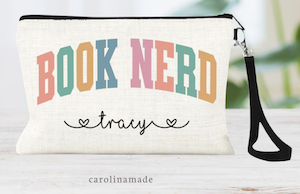 a wrist bag with book nerd in bold colorful font and a personalized name underneath