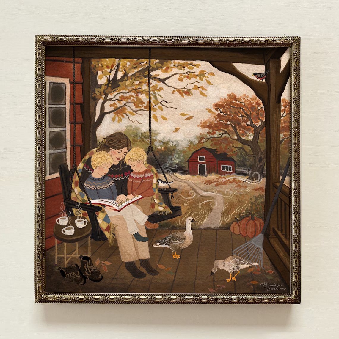 Portrait of a woman reading to two children on a porch swing with an autumn scene in the background