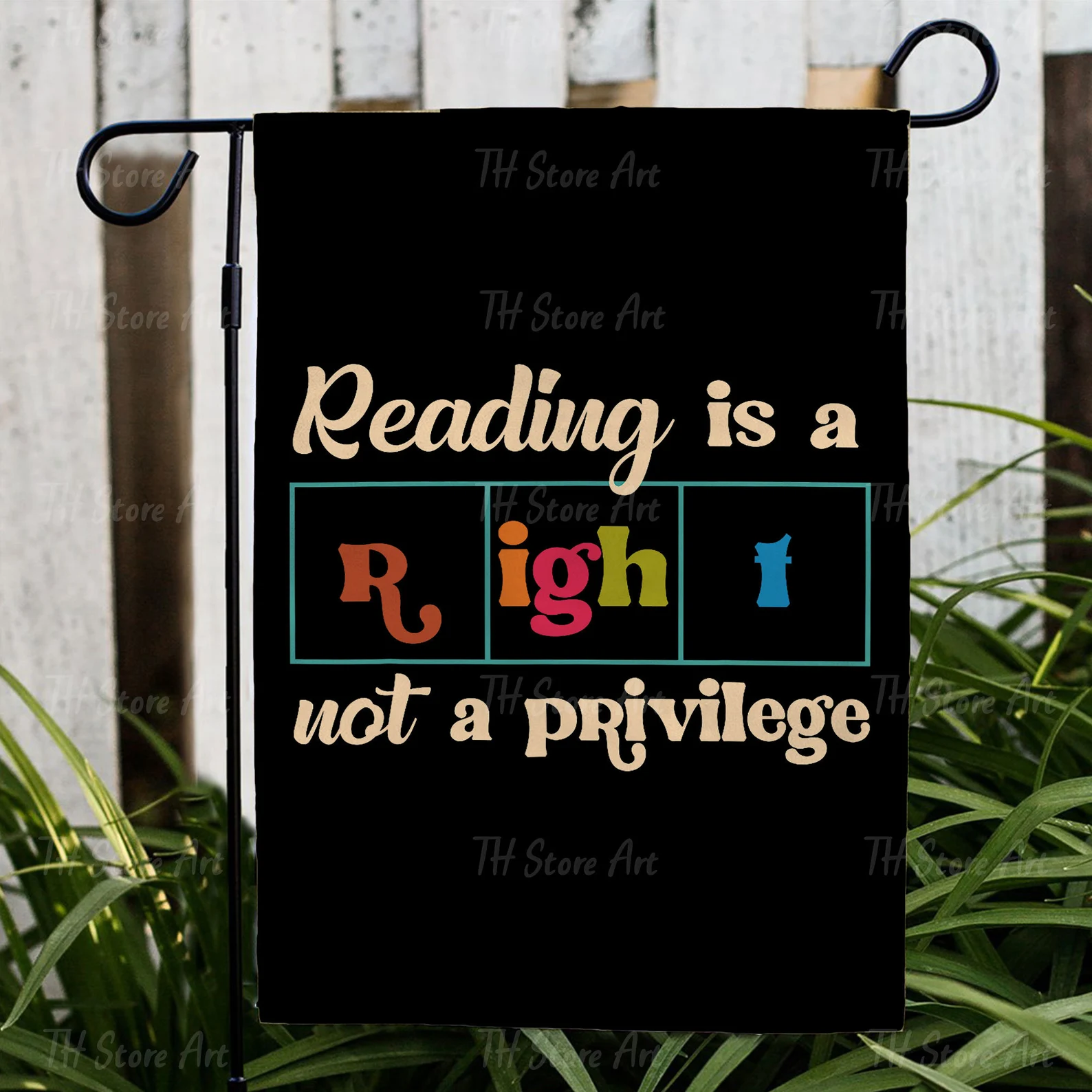 Image of a flag with the words "reading is a right, not a privilege." 