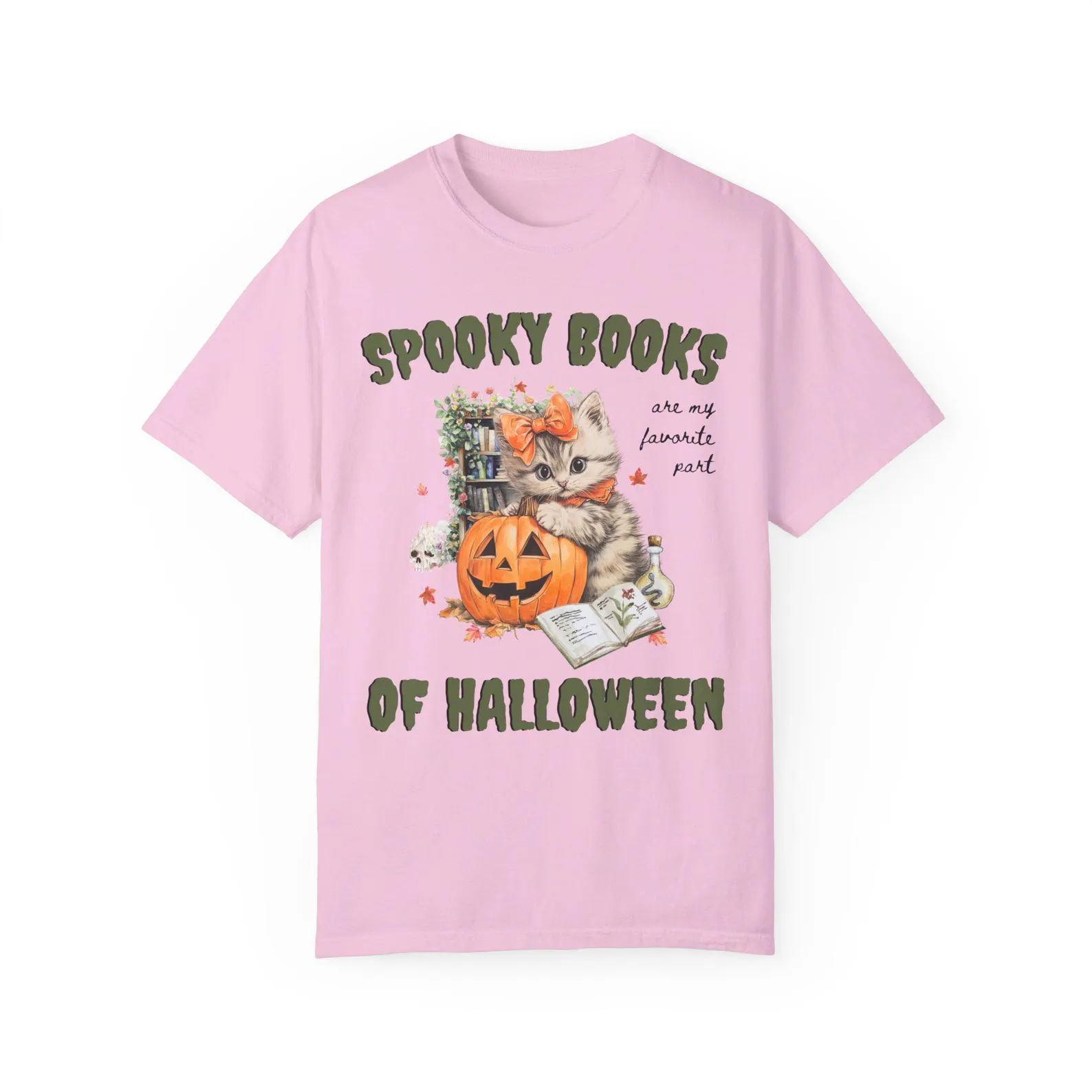 Pink t-shirt with a vintage style image of a cat, book, and pumpkin. In green text it says "spooky books are my favorite part of halloween."