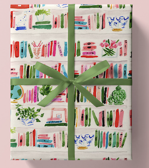 wrapping paper with an illustration of bookshelves with books